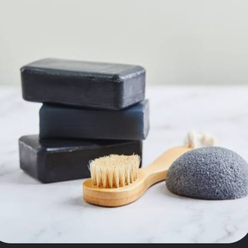 Black charcoal soap bars with wooden brush